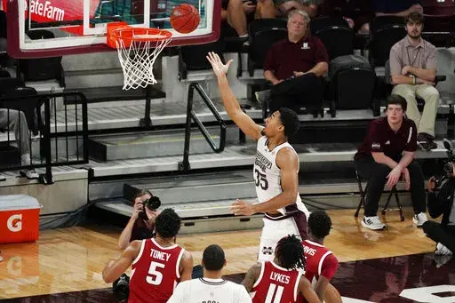 Mississippi State forward Tolu Smith (35) stretches out to make a layup against Arkansas during the second half of an NCAA college basketball game in Starkville, Miss., Wednesday, Dec. 29, 2021. (AP Photo/Rogelio V. Solis)