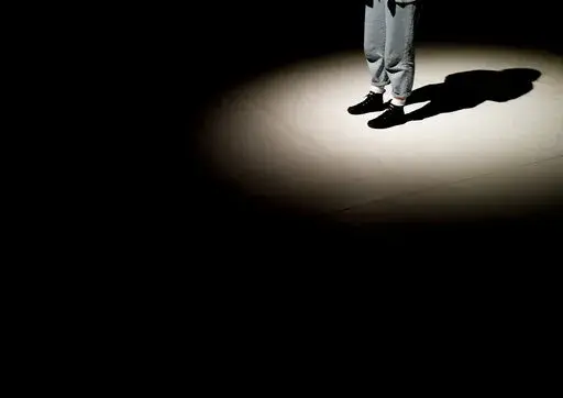 A shadow is cast on the stage of the Trafo House of Contemporary Arts while technicians set up the lighting in Budapest, Hungary, Sept. 19, 2022. Theaters and other cultural institutions in Hungary are reeling from exponentially growing energy prices, and some plan to close for the winter to avoid the skyrocketing bills. The Erkel Theatre in the capital of Budapest will close in November after its utilities went up as much as tenfold, and local governments across the country have ordered theater