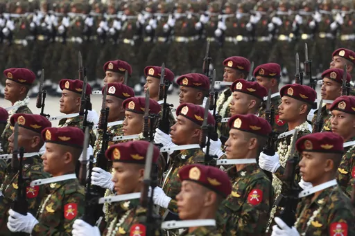 Military officers march during a parade to commemorate Myanmar's 78th Armed Forces Day in Naypyitaw, Myanmar, on March 27, 2023. Myanmar’s military government on Wednesday Feb. 14, 2024 revealed how it will implement its newly activated conscription law, saying it will draft 60,000 young men and women yearly for military service, and that call-ups will begin after the April festival marking the country’s traditional New Year. (AP Photo/Aung Shine Oo, File)
