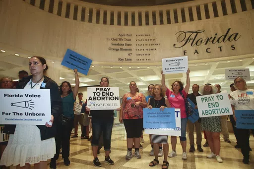 Supporters of Florida Voice For The Unborn demonstrate outside the fourth floor as legislators work on property insurance bills, May 24, 2022, at the state Capitol in Tallahassee, Fla. The Florida Supreme Court ruled Monday, April 1, 2024, that a ballot measure to enshrine the right to abortion in the state constitution can go before voters in November. (AP Photo/Phil Sears, File)