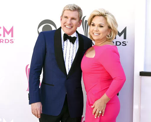 This April 2, 2017, photo shows Todd Chrisley, left, and his wife Julie Chrisley at the 52nd annual Academy of Country Music Awards in Las Vegas. A federal trial for reality television stars Todd and Julie Chrisley on charges including bank fraud and tax evasion is set to start Monday, May 16, 2022, in Atlanta. (Photo by Jordan Strauss/Invision/AP, File)