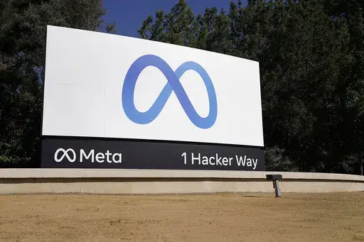 Facebook's Meta logo sign is seen at the company headquarters in Menlo Park, Calif., on, Oct. 28, 2021.  Facebook says it has identified and stopped a sprawling network of fake accounts that spread Russian propaganda about the invasion of Ukraine throughout Western Europe. Facebook parent company Meta says the network created 60 websites that mimicked legitimate news organizations but parroted Russian talking points about Ukraine.   (AP Photo/Tony Avelar, File)