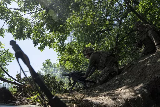A Ukrainian marine of 35th brigade fires by automatic grenade launcher AGS-17 towards Russian positions on the outskirts of Avdiivka, Ukraine, on June 19, 2023. Ukrainian troops are under intense pressure from a determined Russian effort to storm the strategically important eastern Ukraine city of Avdiivka, officials say. Kyiv’s army is struggling with ammunition shortages as the Kremlin’s forces pursue a battlefield triumph around the two-year anniversary of Moscow’s full-scale invasion a