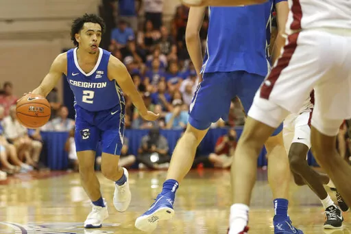 Creighton guard Ryan Nembhard (2) looks for a way through the Arkansas defense during the first half of an NCAA college basketball game, Tuesday, Nov. 22, 2022, in Lahaina, Hawaii. (AP Photo/Marco Garcia)