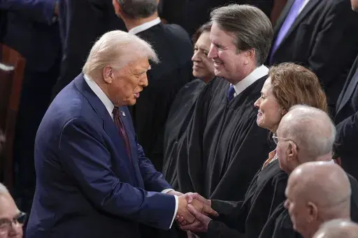 President Donald Trump, left, greets justices of the Supreme Court, from left, Elena Kagan, Brett Kavanaugh and Amy Coney Barrett, before addressing a joint session of Congress at the Capitol in Washington, March 4, 2025. (AP Photo/J. Scott Applewhite, File)