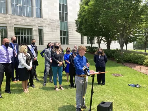 Dylan Brandt speaks at a news conference outside the federal courthouse in Little Rock, Ark., on Wednesday, July 21, 2021. Brandt, 15, has been receiving hormone treatments and is among several transgender youth who challenged a state law banning gender confirming care for trans minors. A federal appeals court on Thursday, Aug. 25, 2022, said Arkansas can't enforce its ban on transgender children receiving gender affirming medical care. (AP Photo/Andrew DeMillo, File)