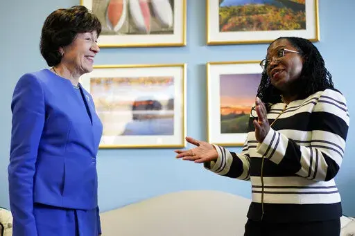 Supreme Court nominee Ketanji Brown Jackson meets with Sen. Susan Collins, R-Maine, on Capitol Hill in Washington, Tuesday, March 8, 2022. Judge Jackson's confirmation hearing starts March 21. If confirmed, she would be the court's first Black female justice. (AP Photo/Carolyn Kaster)