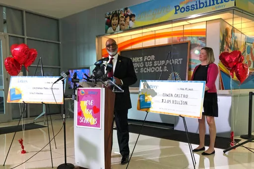 California Lottery Director Alva Johnson announces that Edwin Castro won November's record-high $2.04 billion PowerBall jackpot on Tuesday, Feb. 14, 2023, in Sacramento, Calif. Castro declined to appear at the news conference but said in a written statement he was shocked and ecstatic. The jackpot ticket was sold at Joe's Service Center in Altadena, an unincorporated foothill community northeast of Los Angeles. (AP Photo/Adam Beam)
