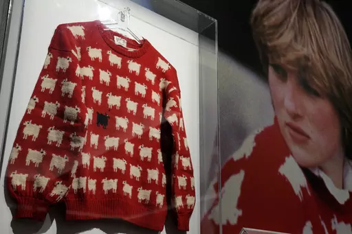 The historic Princess Diana black sheep jumper is on display at the auction house Sotheby's in London, Monday, July 17, 2023. The 'Worn on Several Occasions & Adored by the Fashion Icon' jumper will be on auction headlining Sotheby's inaugural fashion icons sale in New York this September at an Estimate of $50,000 – 80,000, 38,000-61,000 pounds. (AP Photo/Frank Augstein)