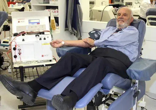 In this May, 2011, photo provided by Australian Red Cross Lifeblood donor James Harrison, credited with saving 2.4 million babies through his record-breaking blood plasma donations over decades, is giving blood at donation center in Sydney. (Australian Red Cross Lifeblood via AP)