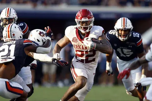 Arkansas running back Ja'Quinden Jackson (22) carries the ball against Auburn during the second half of an NCAA college football game, Saturday, Sept. 21, 2024, in Auburn, Ala.(AP Photo/Butch Dill)