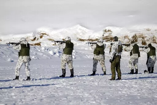 Reservists of the Karelia Brigade shoot with live rounds during the Etel'-Karjala 22 (South Karelia 22) local defence exercise in Taipalsaari, south-eastern Finland, on March 9, 2022.  Finland appears on the cusp of joining NATO. Sweden could follow suit. By year's end, they could stand among the alliance's ranks. Russia's war in Ukraine has provoked a public about face on membership in the two Nordic countries. They are already NATO's closest partners, but should Russia respond to their members