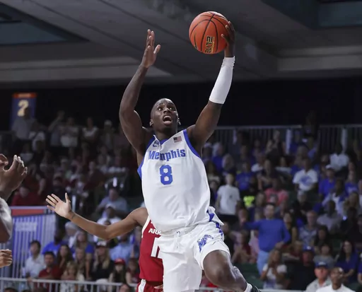 In a photo provided by Bahamas Visual Services, Memphis' David Jones (8) shoots during the second half of an NCAA college basketball game against Arkansas in the Battle 4 Atlantis at Paradise Island, Bahamas, Thursday, Nov. 23, 2023. (Tim Aylen/Bahamas Visual Services via AP)
