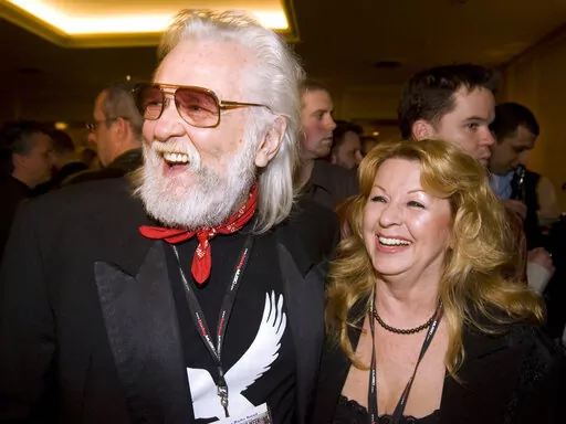Ronnie and Wanda Hawkins arrive for the Canadian Music Industry Awards in Toronto, Thursday, March 8, 2007. Ronnie Hawkins, a brash rockabilly star from Arkansas who became a patron of the Canadian music scene after moving north and recruiting a handful of local musicians later known as the Band, died Sunday, May 29, 2022. He was 87. (Frank Gunn/The Canadian Press via AP, File)