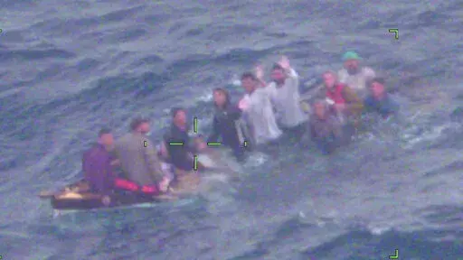 This image made available by the the U.S. Coast Guard shows Cuban migrants on a sinking vessel spotted on Thursday, Feb. 3, 2022, about 40 miles off Key Largo, Fla. “They didn’t have lifejackets or safety equipment,” said Capt. Shawn Koch, commanding officer of Air Station Miami. “If the air crew hadn’t found them on the patrol, these people would not have survived the night.”  The migrants were repatriated to Cuba, the Coast Guard said. (U.S. Coast Guard via AP)