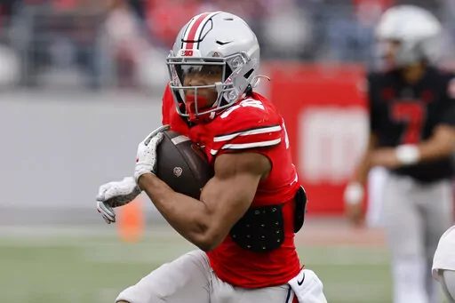Ohio State running back TreVeyon Henderson plays in an NCAA college spring football game Saturday, April 16, 2022, in Columbus, Ohio. Henderson was selected to The Associated Press preseason All-America team, Monday, Aug. 22, 2022. (AP Photo/Jay LaPrete, File)