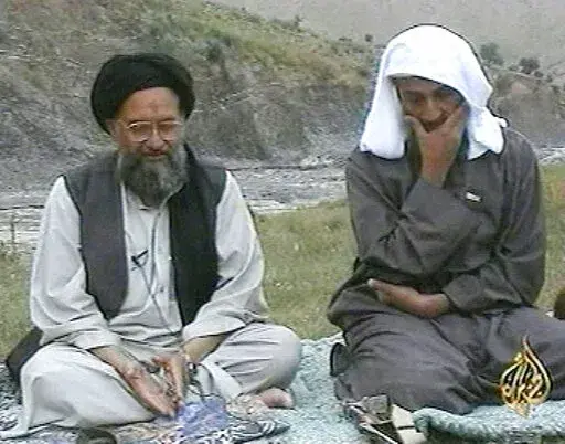 In this television image from Arab satellite station Al-Jazeera, Osama bin Laden, right, listens as his top deputy Ayman al-Zawahri speaks at an undisclosed location, in this image made from undated video tape broadcast by the station April 15, 2002. A U.S. airstrike has killed al-Qaida leader Ayman al-Zawahri in Afghanistan, according to a person familiar with the matter. President Joe Biden will speak about the operation on Monday night, Aug. 1, 2022, from the White House. (AP Photo/Al-Jazeera
