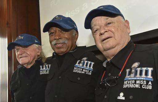 Members of the Never Miss a Super Bowl Club, from the left, Tom Henschel, Gregory Eaton, and Don Crisman pose for a group photograph during a welcome luncheon, in Atlanta, Friday, Feb. 1, 2019. As long as they still have each other, they're still going to go to every Super Bowl. That's the sentiment shared by the three friends who say they are the final fans who can claim membership in the exclusive “never missed a Super Bowl” club. And they're back again for number 58 — Super Bowl 58 — 