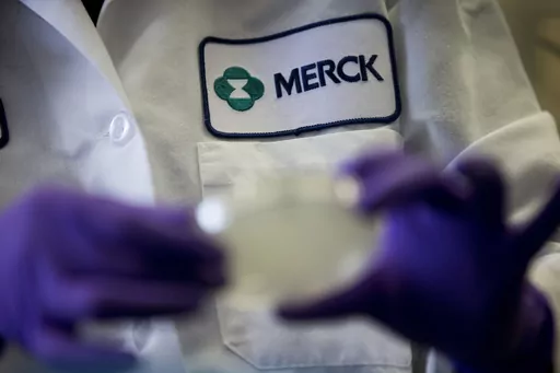 A Merck scientist conducts research on Feb. 28, 2013, in West Point, Pa. Merck is suing the federal government Tuesday, June 6, 2023, over a plan to negotiate Medicare drug prices, calling the program a sham equivalent to extortion. The drugmaker is seeking to halt the program, which was laid out in the Inflation Reduction Act and is expected to save taxpayers billions of dollars in the coming years. (AP Photo/Matt Rourke, File)