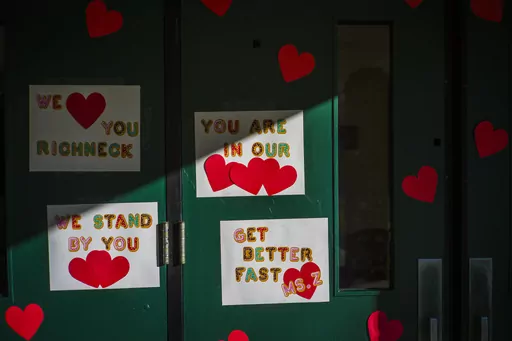 Messages of support for teacher Abby Zwerner, who was shot by a 6-year-old student, grace the front door of Richneck Elementary School Newport News, Va. on Jan. 9, 2023. Zwerner said Monday, March 20, that she has had four surgeries and has gone through a challenging recovery. (AP Photo/John C. Clark, File)