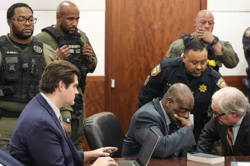 Former Houston police officer Gerald Goines sits in the courtroom after he was sentenced to 60 years behind bars on a pair of felony murder convictions on Tuesday, Oct. 8, 2024, in Houston. Goines was found guilty of felony murder in the 2019 deaths of Dennis Tuttle and Rhogena Nicholas. (Brett Coomer/Houston Chronicle via AP)