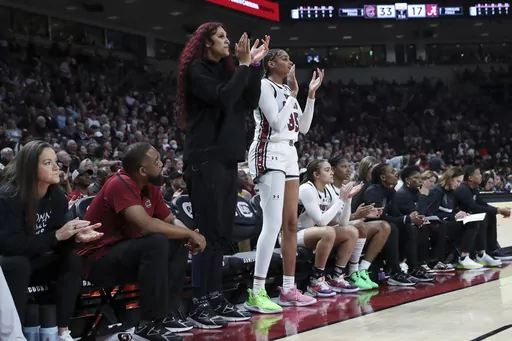 South Carolina center Kamilla Cardoso, left, and center Sakima Walker (35) encourage teammates during the second half of the team's NCAA college basketball game against Alabama on Thursday, Feb. 22, 2024, in Columbia, S.C. (AP Photo/Artie Walker Jr.)