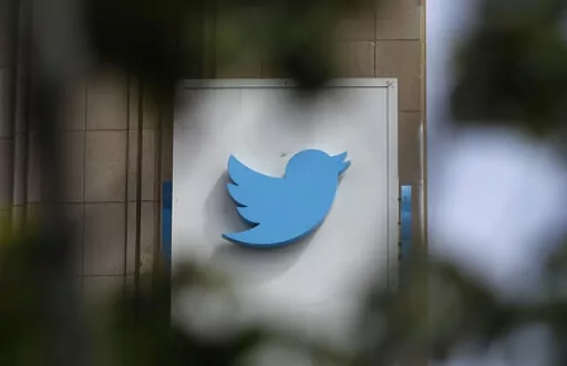 This July 9, 2019, file photo shows a sign outside of the Twitter office building in San Francisco. Twitter said on late Tuesday, Jan. 3, 2023, that it will ease up on its 3-year-old ban on political advertising, the latest change by Elon Musk as he tries to pump up revenue after purchasing the social media platform last year. (AP Photo/Jeff Chiu, File)