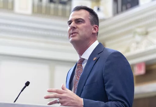 Oklahoma Gov. Kevin Stitt delivers his State of the State address in Oklahoma City, on Monday, Feb. 7, 2022. Stitt has signed a bill prohibiting the use of nonbinary gender markers on state birth certificates. The first-term Republican signed the bill Tuesday, April 26, 2022.  (AP Photo/Alonzo Adams, File)
