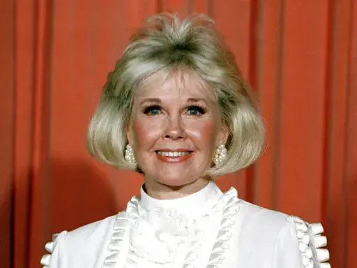 Actor and animal rights activist Doris Day poses for photos after receiving the Cecil B. DeMille Award she was presented with at the annual Golden Globe Awards ceremony in Los Angeles on Jan. 28, 1989. The 100th anniversary of Doris Day’s birthday is being by with a social-media fundraiser honoring her passion for animals. The Doris Day Animal Foundation is asking people to donate to the foundation to help support animal welfare programs nationwide. Day died May 13, 2019, at age 97. (AP Photo,