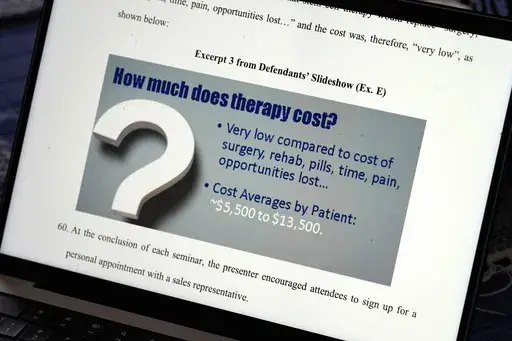 A court exhibit from a lawsuit filed by Iowa Attorney General Brenna Bird is seen on a laptop computer, Wednesday, May 8, 2024, in Urbandale, Iowa. The flyers descended upon Iowa mailboxes promising "Life Without Pain!" -- thanks to injections or IVs filled with stem cells that could be administered in a patient's own home for thousands of dollars. But experts call these treatments quackery, and last fall, Bird sued a Minnesota man who hosts a Christian entrepreneurship podcast and his Florida b