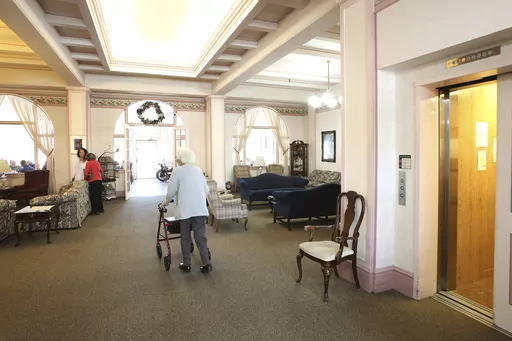 Bret Harte Retirement Inn residents make their way down to the dining room for lunch on May 6, 2020 in Grass Valley, Calif. As many as 8 in 10 older Americans couldn’t afford more than four years in an assisted living facility or two years in a nursing home, according to a recent analysis. This is particularly hard for people in the monetary middle; they don’t have enough to cover the costs of long-term care, but they have too many assets to qualify for government assistance. (Elias Funez/Th