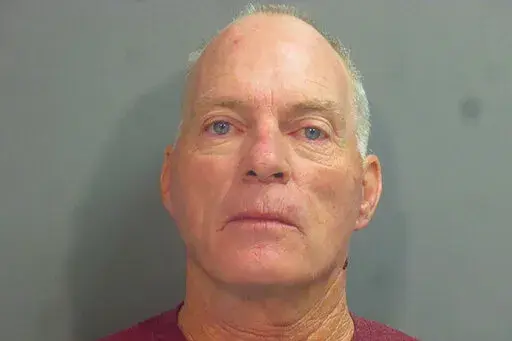 This undated photo provided by the Washington County, Ark., Sheriff's Office shows Arkansas resident Richard Barnett, A September trial date has been set for Barnett, an Arkansas man who was photographed with his feet on a desk in House Speaker Nancy Pelosi's office during the Jan. 6, U.S. Capitol riot. Barnett of Gravette was among supporters of President Donald Trump who stormed the Capitol as lawmakers assembled to certify Joe Biden's victory over Trump. Prosecutors say Barnett was carrying a