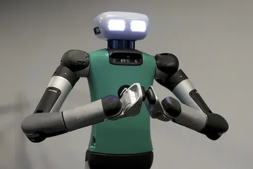 Agility Robotics' robot Digit performs gestures at the company's office in Pittsburgh, Wednesday, Aug. 16, 2023. Agility co-founder Jonathan Hurst said, “We’re trying to make robots that can operate in human spaces.” (AP Photo/Matt Freed)