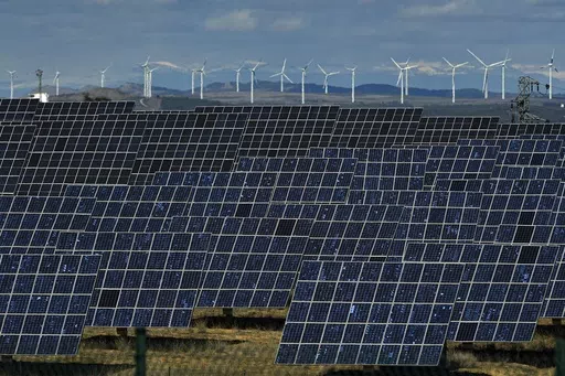 Solar panels work near the small town of Milagro, Navarra Province, northern Spain, Feb. 24, 2023. Billions of people are using different kinds of energy each day and 2023 was a record-breaking year for renewable energy sources, according to a report published Wednesday, May 8, 2024, by Ember, a think tank based in London. (AP Photo/Alvaro Barrientos, File)