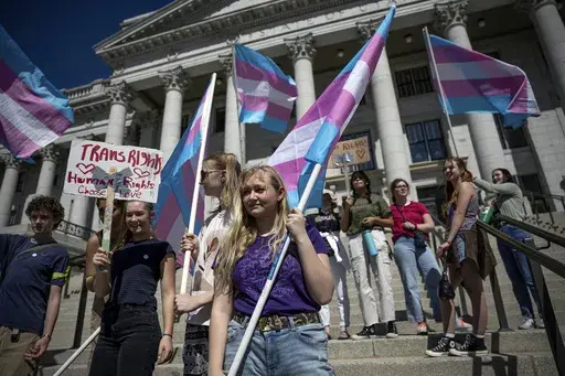 Misy Sifre, 17, and others protest for transgender rights at the Capitol in Salt Lake City, March 25, 2022. On Tuesday, July 2, 2024, a federal judge in Kansas blocked a federal rule expanding anti-discrimination protections for LGBTQ+ students from being enforced in four states, including Utah and a patchwork of places elsewhere across the nation. (Spenser Heaps/The Deseret News via AP, File)