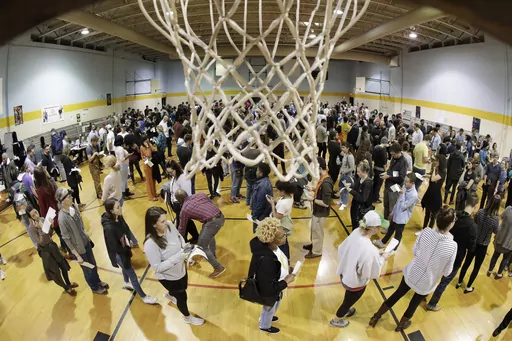 People wait to vote on Super Tuesday in the gymnasium at Cleveland Park Community Center, Tuesday, March 3, 2020, in Nashville, Tenn. While most GOP presidential candidates are focused only on early states like Iowa and New Hampshire, Donald Trump and Ron DeSantis also are looking ahead to Super Tuesday. March 5, 2024 is when the largest number of of delegates are up for grabs of any single day in the primary cycle. (AP Photo/Mark Humphrey, File)