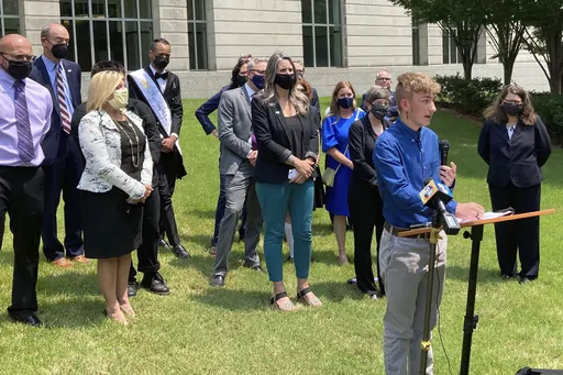 Dylan Brandt speaks at a news conference outside the federal courthouse in Little Rock, Ark., July 21, 2021. Brandt, a teenager, is among several transgender youth and families who are plaintiffs challenging a state law banning gender confirming care for trans minors. A federal judge struck down Arkansas' first-in-the-nation ban on gender-affirming care for children as unconstitutional Tuesday, June 20, 2023. (AP Photo/Andrew DeMillo, File)