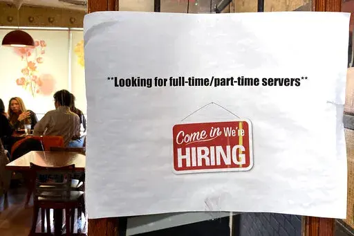 A hiring sign is displayed at a restaurant in Morton Grove, Ill., Thursday, April 28, 2022.  Labor Department releases weekly report on unemployment benefits on Wednesday, Nov. 23.  (AP Photo/Nam Y. Huh, File)