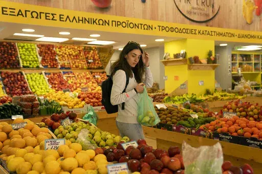 Personal trainer Antonia Kalantzi, 38, shops at a grocery store in Athens, Greece, on Feb. 16, 2022. Inflation in Europe soared to another record, a fresh sign that rising energy prices fueled by Russia’s war in Ukraine are squeezing consumers and adding pressure on the central bank to raise interest rates. 
Consumer prices in the 19 countries that use the euro currency rose by an annual rate of 7.5% in March, according to the European Union statistics agency, Eurostat.The latest reading smas