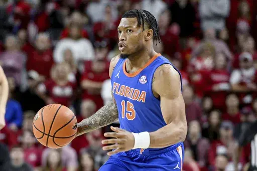 Florida guard Alijah Martin (15) runs a play against Arkansas during the first half of an NCAA college basketball game Saturday, Jan. 11, 2025, in Fayetteville, Ark. (AP Photo/Michael Woods)