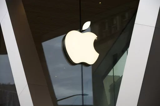 An Apple logo adorns the facade of the downtown Brooklyn Apple store on March 14, 2020, in New York. Apple is getting into the Buy Now, Pay Later space with a few tweaks to the existing model — including no option to pay with a credit card. The company will roll out the product to some consumers spring 2023, and will begin reporting the loans to credit bureaus in the fall. (AP Photo/Kathy Willens, File)