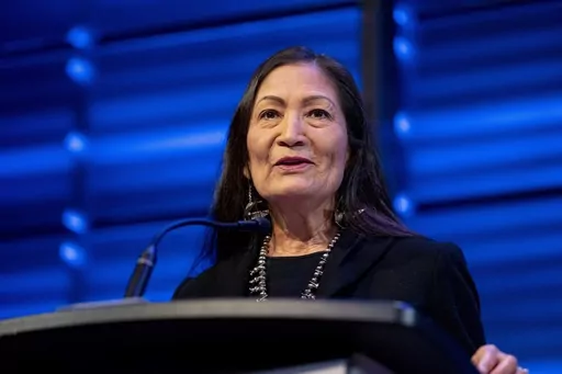 Interior Secretary Deb Haaland announces that her agency will work to restore more large bison herds during a speech for World Wildlife Day at the National Geographic Society in Washington, March 3, 2023. (AP Photo/Andrew Harnik, File)