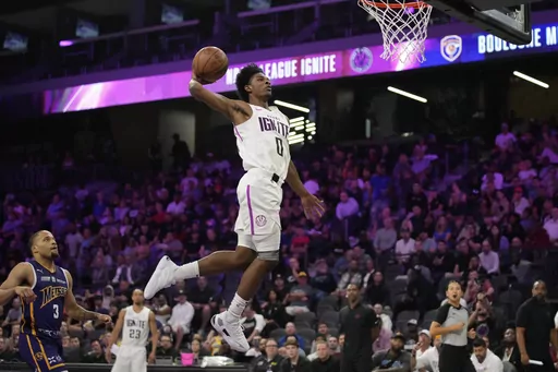 NBA G League Ignite's Scoot Henderson dunks against the Boulogne-Levallois Metropolitans 92 during the first half of an exhibition basketball game Oct. 4, 2022, in Henderson, Nev. Henderson is among the top guards in the upcoming NBA draft. (AP Photo/John Locher, File)