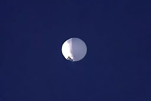 A high altitude balloon floats over Billings, Mont., on Wednesday, Feb. 1, 2023. The huge, high-altitude Chinese balloon sailed across the U.S. on Friday, drawing severe Pentagon accusations of spying and sending excited or alarmed Americans outside with binoculars. Secretary of State Antony Blinken abruptly canceled a high-stakes Beijing trip aimed at easing U..S.-China tensions.(Larry Mayer/The Billings Gazette via AP)