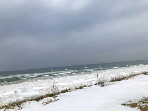 Lake Michigan shoreline in Ottawa County, Mich., is shown on Feb. 1, 2022. Despite its closeness to the lake, the county has areas where household and business wells are running short of water. That's because the aquifer beneath the county has dropped significantly in recent decades and it has no connection to the lake. Experts say Ottawa County is a cautionary tale for the state of Michigan, which is trying to leverage its water abundance to build a "blue economy" as climate change brings more 