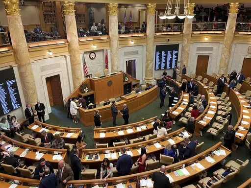Arkansas lawmakers gather in the House of Representatives chamber at the state Capitol in Little Rock, Ark. on Monday, Jan. 9, 2023. The state Legislature convened for the first day of the 2023 session, a day before Sarah Huckabee Sanders was set to be sworn in as the state's 47th governor. (AP Photo/Andrew DeMillo)