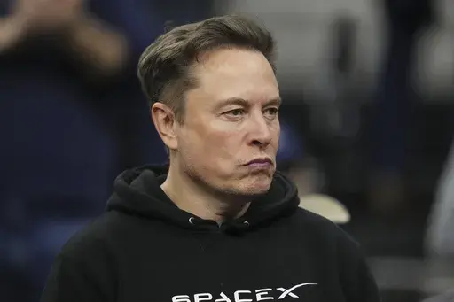 Elon Musk attends the finals at the NCAA wrestling championship, Saturday, March 22, 2025, in Philadelphia. (AP Photo/Matt Rourke)