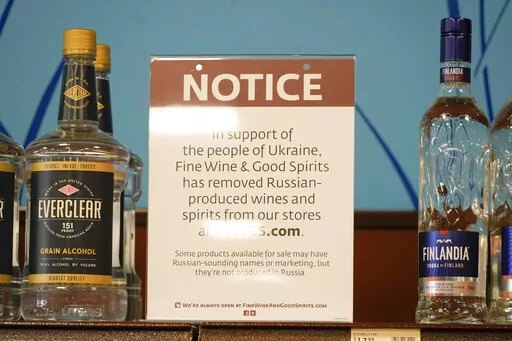 A sign in the vodka area of a Pennsylvania Fine Wine and Good Spirits store reflects the states decision to withdraw Russian-made products for sale, Monday, Feb. 28, 2022, in Harmony, Pa. (AP Photo/Keith Srakocic)