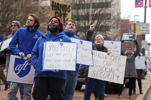 Demonstrators gather outside of the Edward A. Garmatz United States District Courthouse in Baltimore, on Friday, March 14, 2025, before a hearing regarding the Department of Government Efficiency's access to Social Security data. (AP Photo/Stephanie Scarbrough)