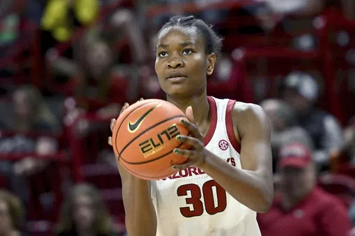 Arkansas forward Maryam Dauda (30) shoots during an NCAA basketball game against LSU, Thursday, Dec. 29, 2022, in Fayetteville, Ark. Dauda to its national championship roster. Dauda, who is 6-foot-4, spent the past three seasons with the Razorbacks. She announced her commitment to the Gamecocks on social media Wednesday, May 29, 2024. (AP Photo/Michael Woods, File)